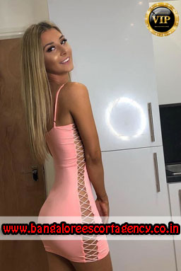 escort girl in shiny white dress